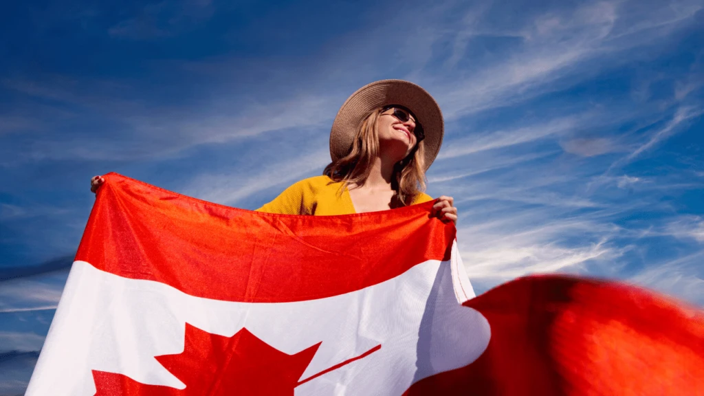 a woman holding a canada flag